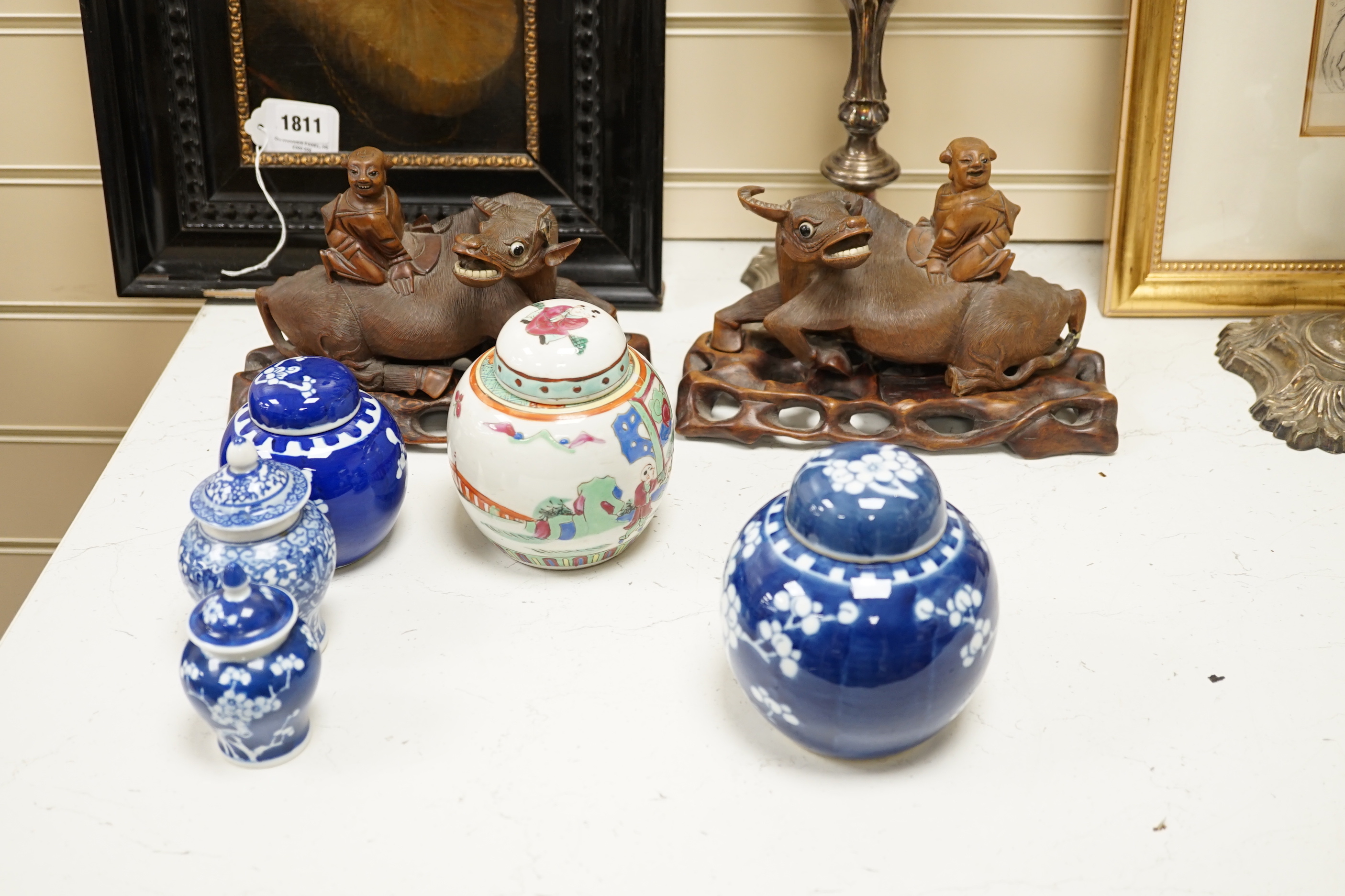 Sixteen mainly Chinese items, including small ginger jars, a pair of carved wood bulls on stands, dishes and bowls, etc.